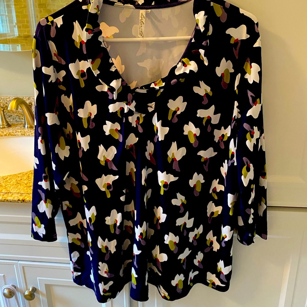 Woman’s blouse for the dressy party. Flattering neck line. Very comfortable